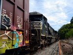 NS yard job E19 climbs the grade with cars from CSX.